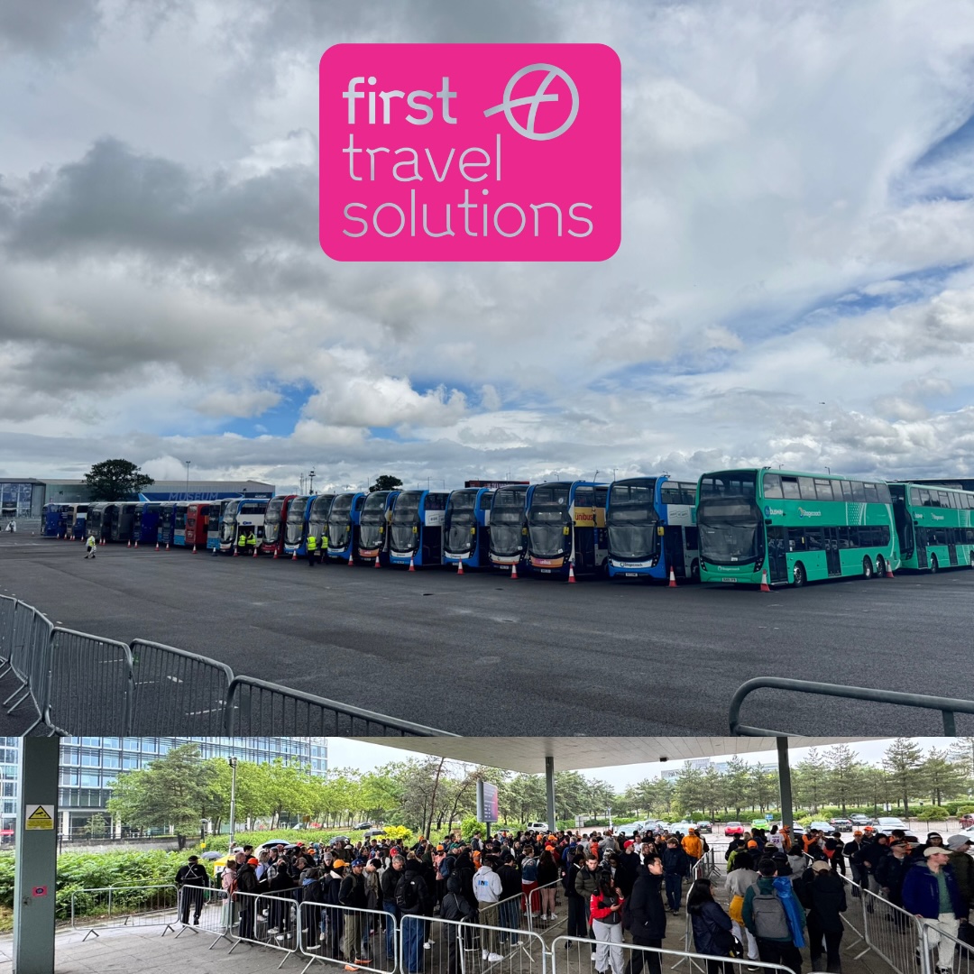 Coaches lined up with people waiting to board at silverstone 
